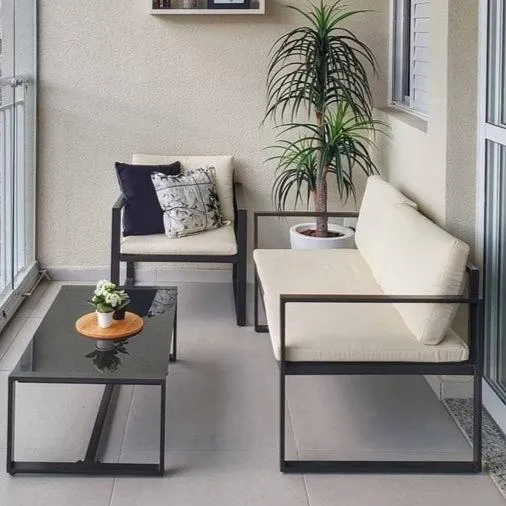 Balcony Design With Sleek Black Metal Furniture, Neutral Tones, And Greenery For A Relaxing Outdoor Retreat